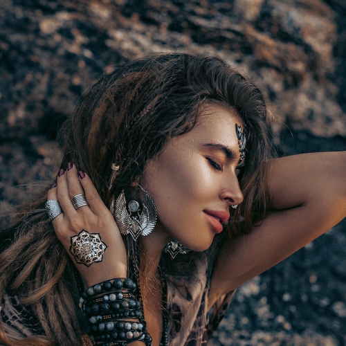 Woman Modeling Jewelry Near Rocks