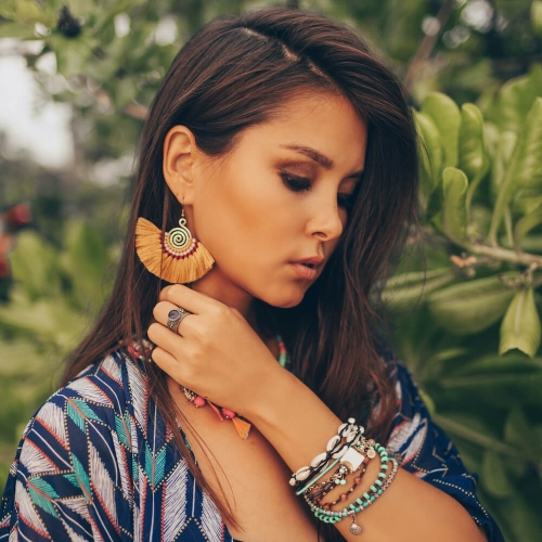 Woman Modeling Jewelry Near Tropical Plants
